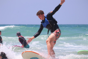 Photo of a guy surfing in Bat Yam, Israel 