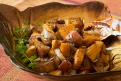 Roasted squash and apples in a copper colored bowl
