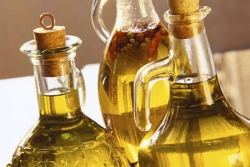Three glass bottles of olive oil