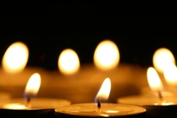 blurred candles against a black background