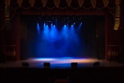 Dark theater with stage light on