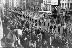 Black and white archival image of a Nazi march down East 86th Street in NYC on October 30th 1939