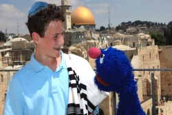A blue monster named Grover and boy in Israel