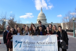 Teens standing in front of the United States Capitol building 