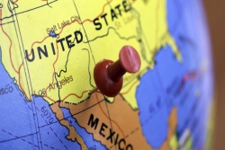 Map of US and Mexico with a pushpin at the border