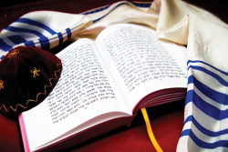 prayerbook with tallit and kippah