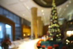 Blurry Christmas tree in the lobby of a building like a workplace or hotel