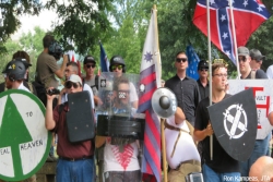 Protesters hold shields and Confederate flags at an alt right rally in Charlottesville Virginia