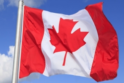 Canadian flag flying in the breeze