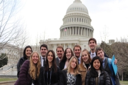 Group of smiling teens standing in front of the US Capitol building