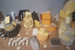 A variety of cheeses spread out on a table