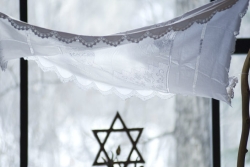 White lace chuppah with Star of David below