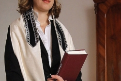 a woman wearing a tallit