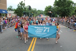 The Religious Action Center contingent marches in the 2018 Capital Pride Parade with banner
