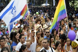 Israeli and rainbow flags at gay pride parade in Tel Aviv