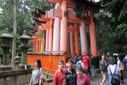 The author's wife and two sons in front of a Japanese holy site