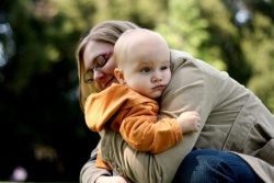 woman hugging her child