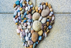 heart comprised of different size and color pebbles