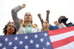 Teens holding an American flag