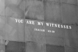 Stone wall engraved with the Biblical quote YOU ARE MY WITNESSES from Isaiah