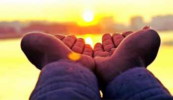 Hands outstretched in prayer during the Jewish High Holidays