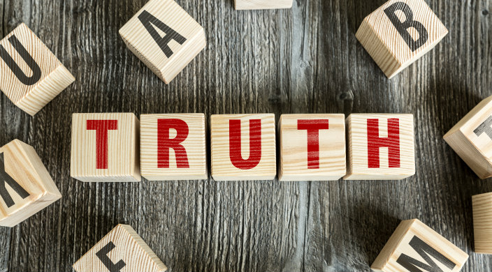 Wooden blocks that spell truth in red letters