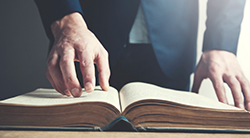 A man reads a Bible book