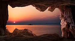 Sunset view from the inside of a cave