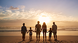 Family looks at a sunset
