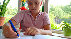 Young girl writing