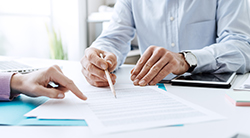 A lender and a debtor go over terms of a contract