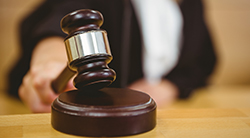 A judge pounds the gavel