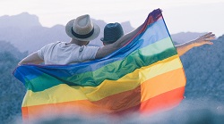 Two men with a gay pride flag