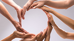 Circle of women's hands