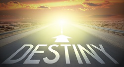 A road with writing that says, "destiny"