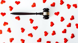 a gavel surrounded by hearts